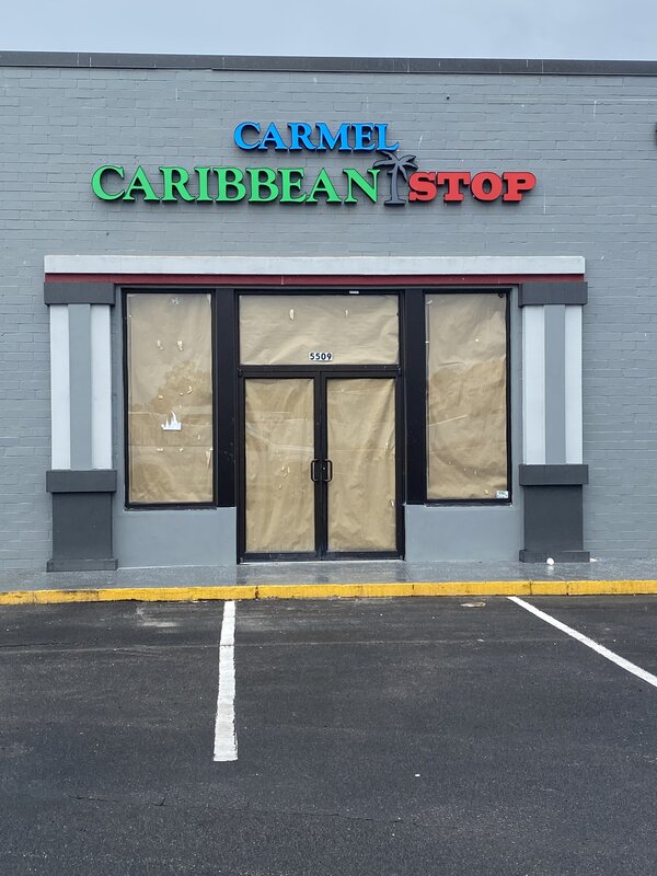 Colorful channel letter sign for Carmel Caribbean Stop in Jacksonville