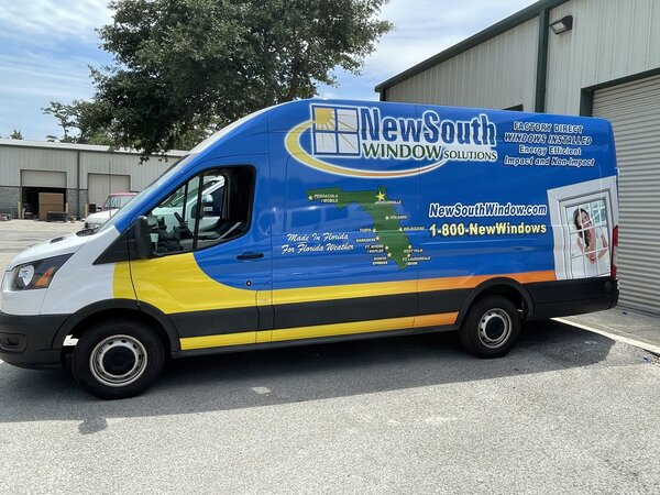 Commercial vehicle wraps on New South Window Solutions van installed by Jacksonville Signs & Graphics