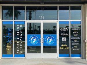 Vinyl window graphics for St Johns Chiropractic designed by Jacksonville Signs & Graphics